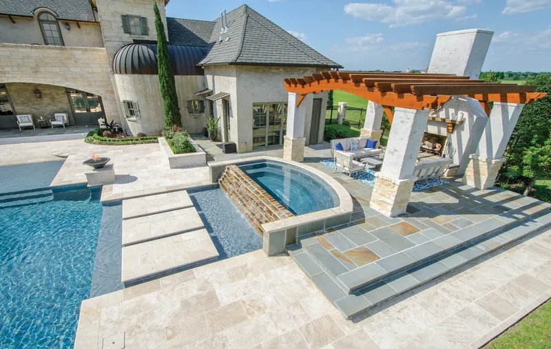 Pool deck and patio paved in stone-look pavers