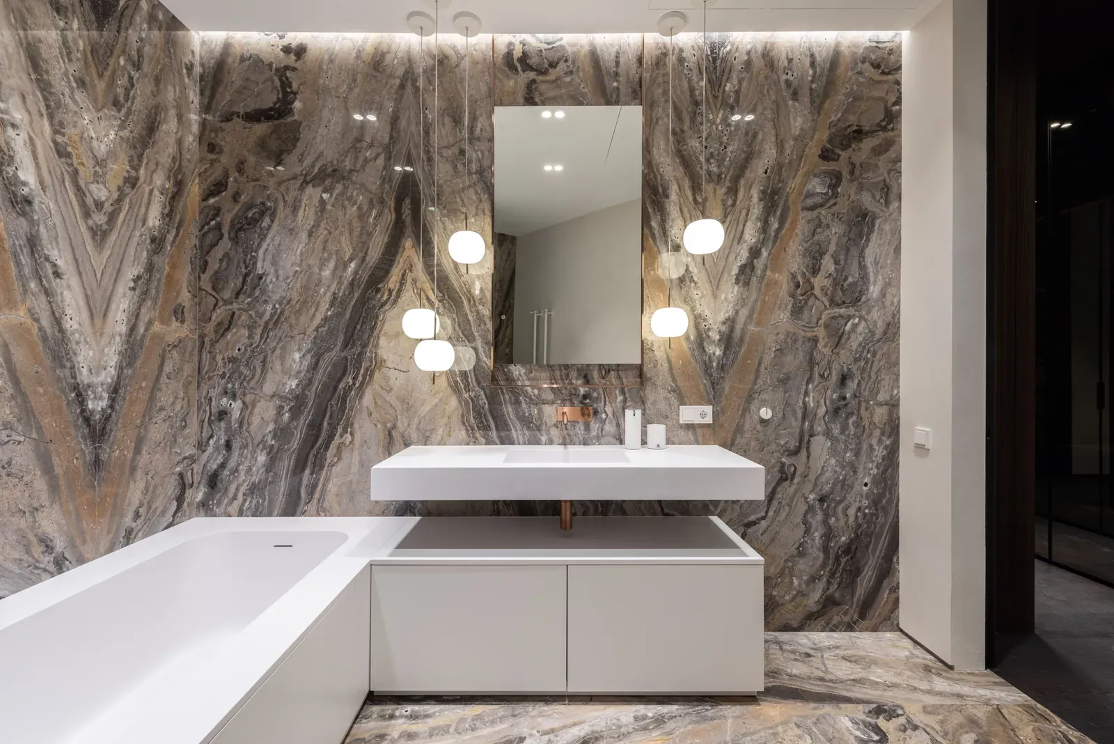Bookmatched marble-look porcelain slab bathroom