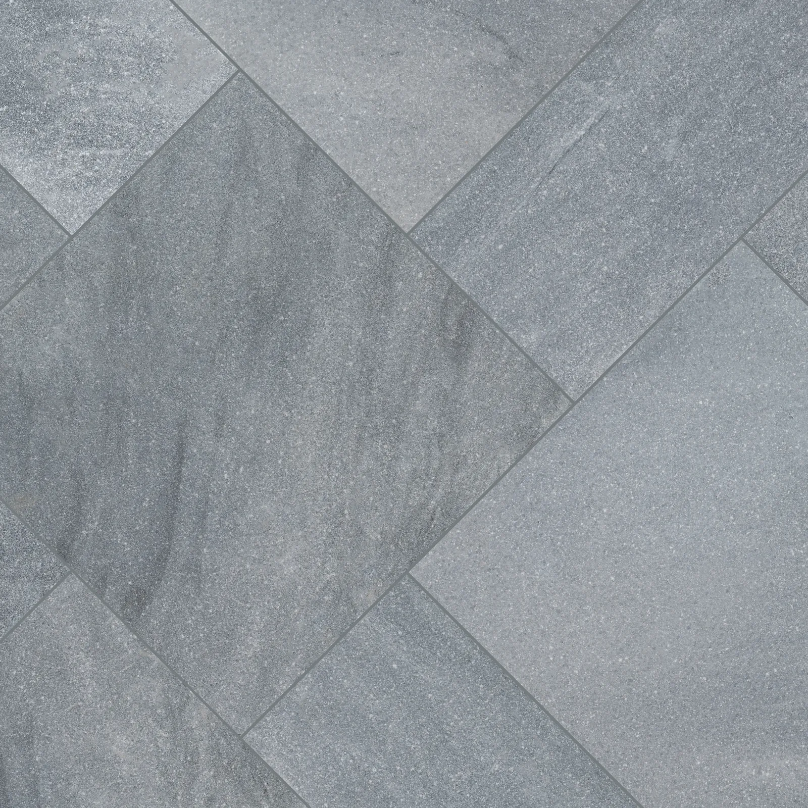 Gray stone-look porcelain pavers laid on the diagonal