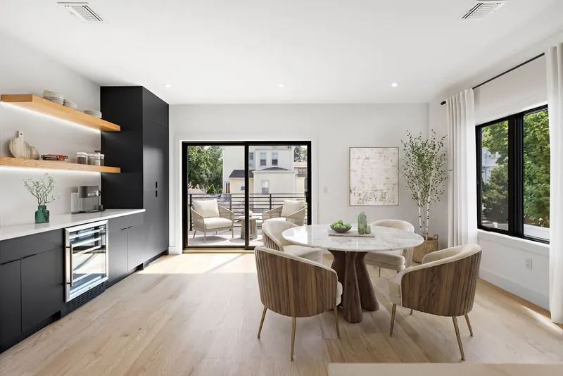 Bar with floating shelves in Cliffside Park, NJ: Black flat-panel cabinets, wine fridge, floating oak shelves