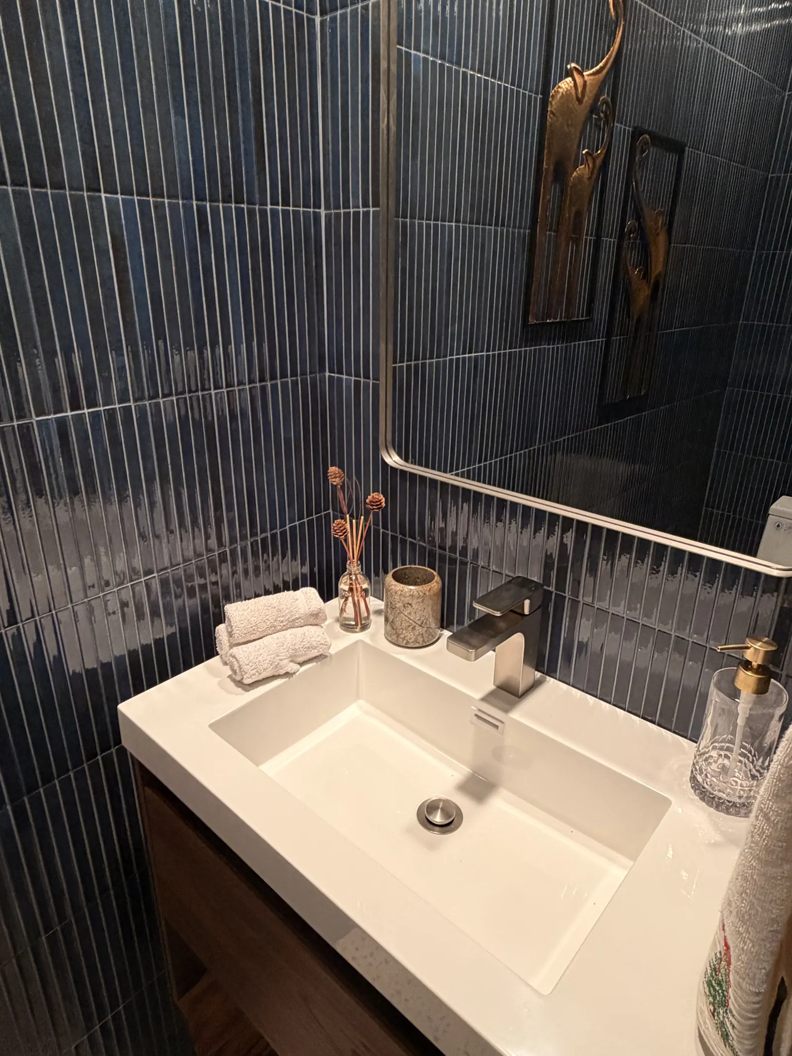 Green zellige-look tile powder room with floating vanity