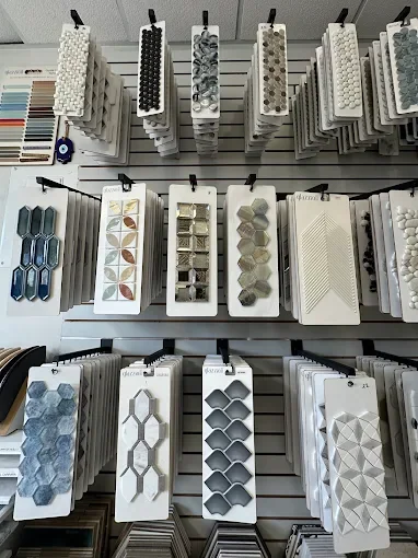 Glass, stone and porcelain mosaic samples on the Avanos showroom wall